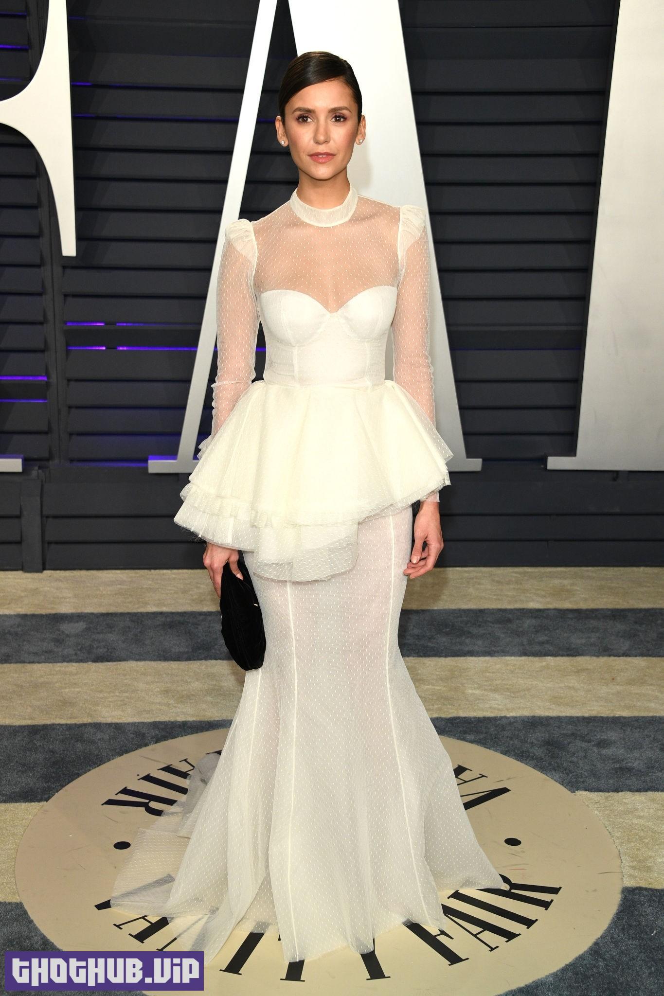 1709634175 297 Nina Dobrev Sexy in White at Oscar Party